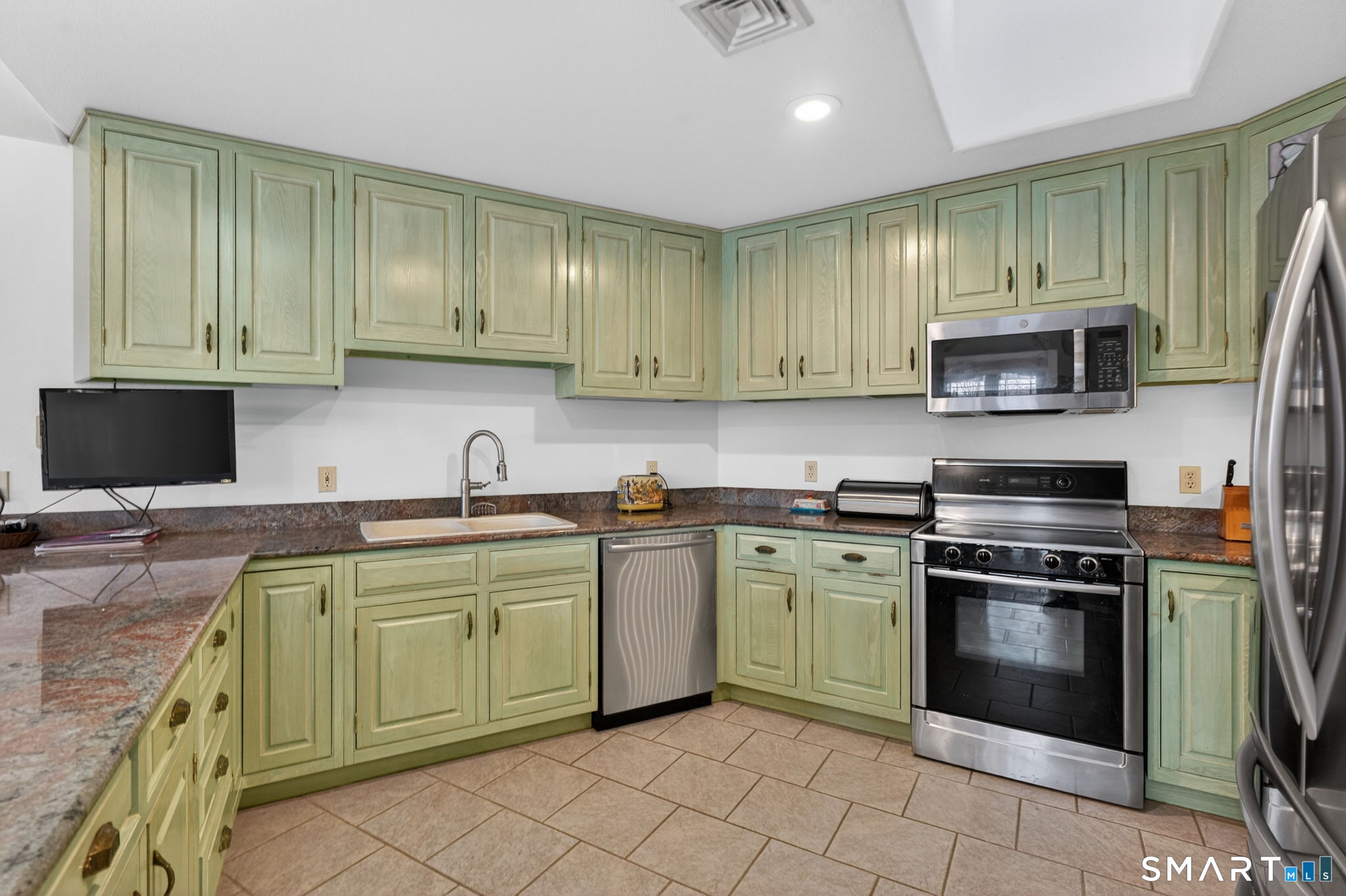 349 South Bigelow Road Hampton, CT 06247 - Photo 4 of 40 a kitchen with a stove sink and cabinets