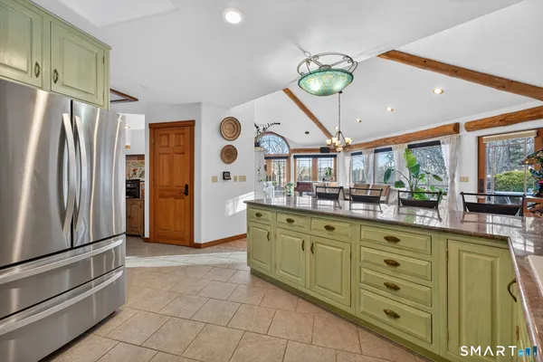 a kitchen with cabinets and stainless steel appliances