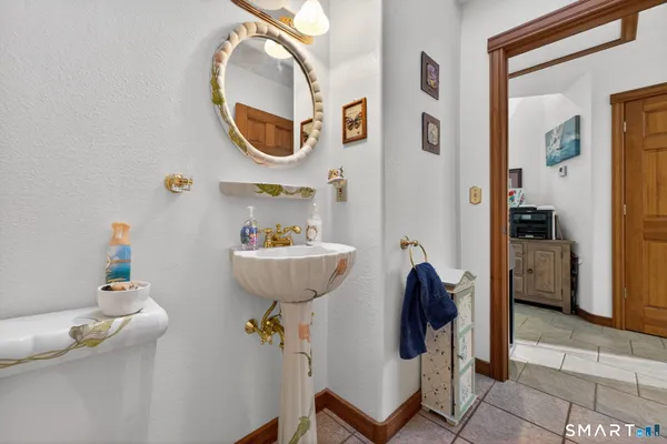 a bathroom with a sink and a mirror