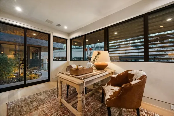 a dining room with furniture and window