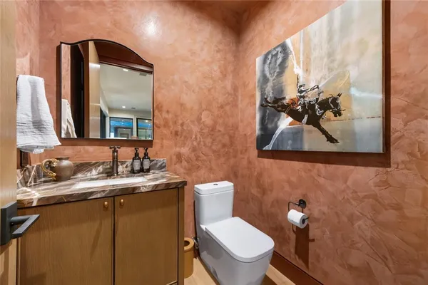 a door with a painting on the wall