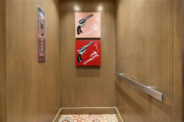 a kitchen with stainless steel appliances granite countertop a sink a stove and a wooden floors