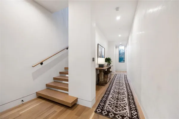 a large kitchen with stainless steel appliances granite countertop a sink and cabinets