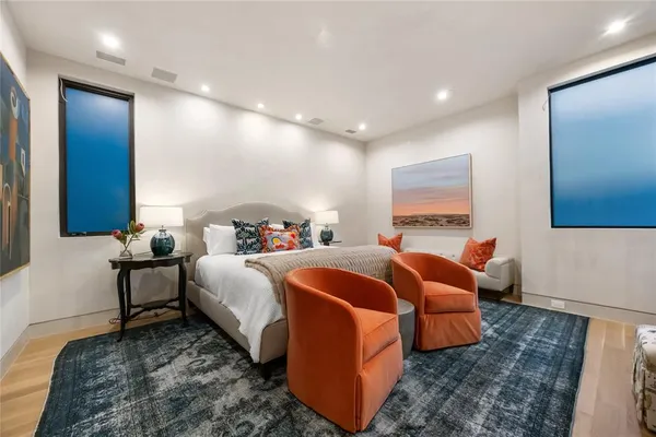 a bed room with bed and balcony