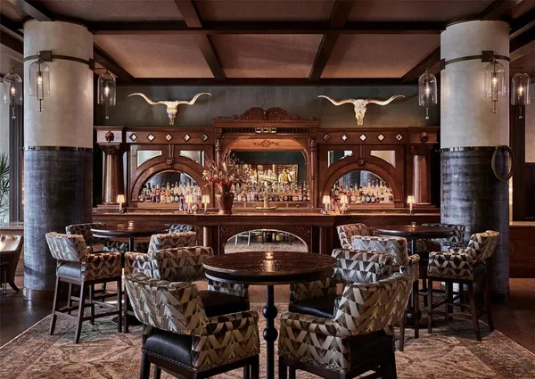 a view of a chairs and table in a patio
