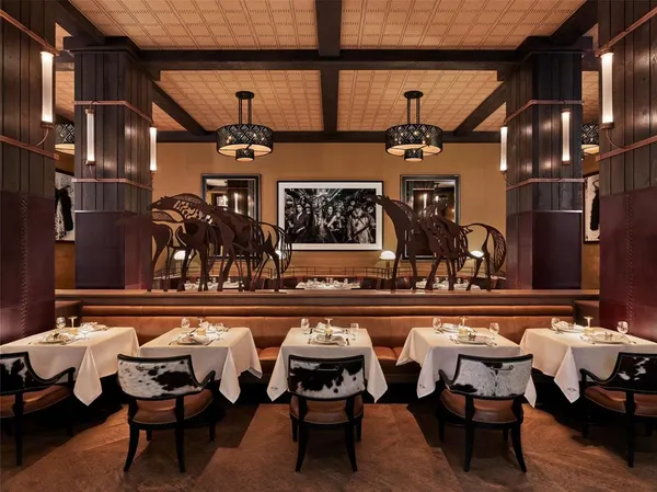 a view of a chairs and a table in a balcony