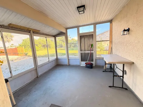a view of game room with window and furniture