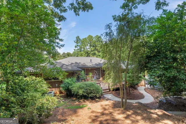 a view of a lot of plants and flowers with yard