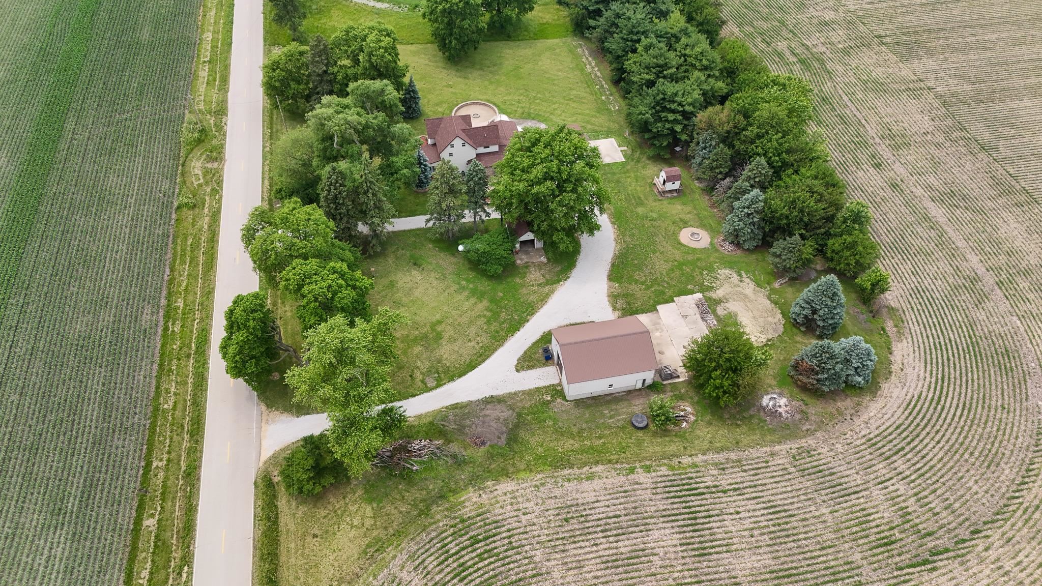 382 Keigwin Road Walnut, IL 61376 - Photo 18 of 68 an aerial view of residential house with outdoor space and trees all around