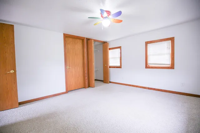 a view of a patio with couches under an umbrella