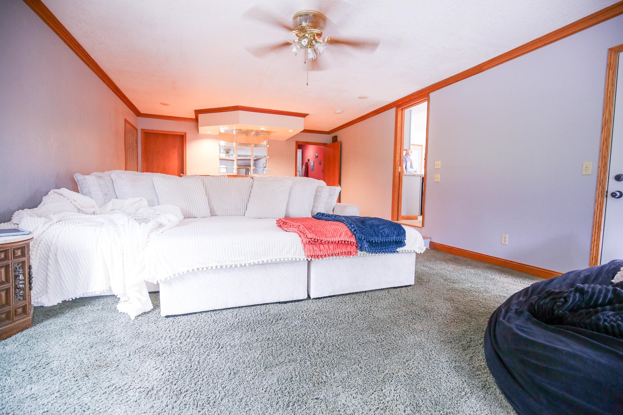 382 Keigwin Road Walnut, IL 61376 - Photo 35 of 68 a living room with furniture and a ceiling fan