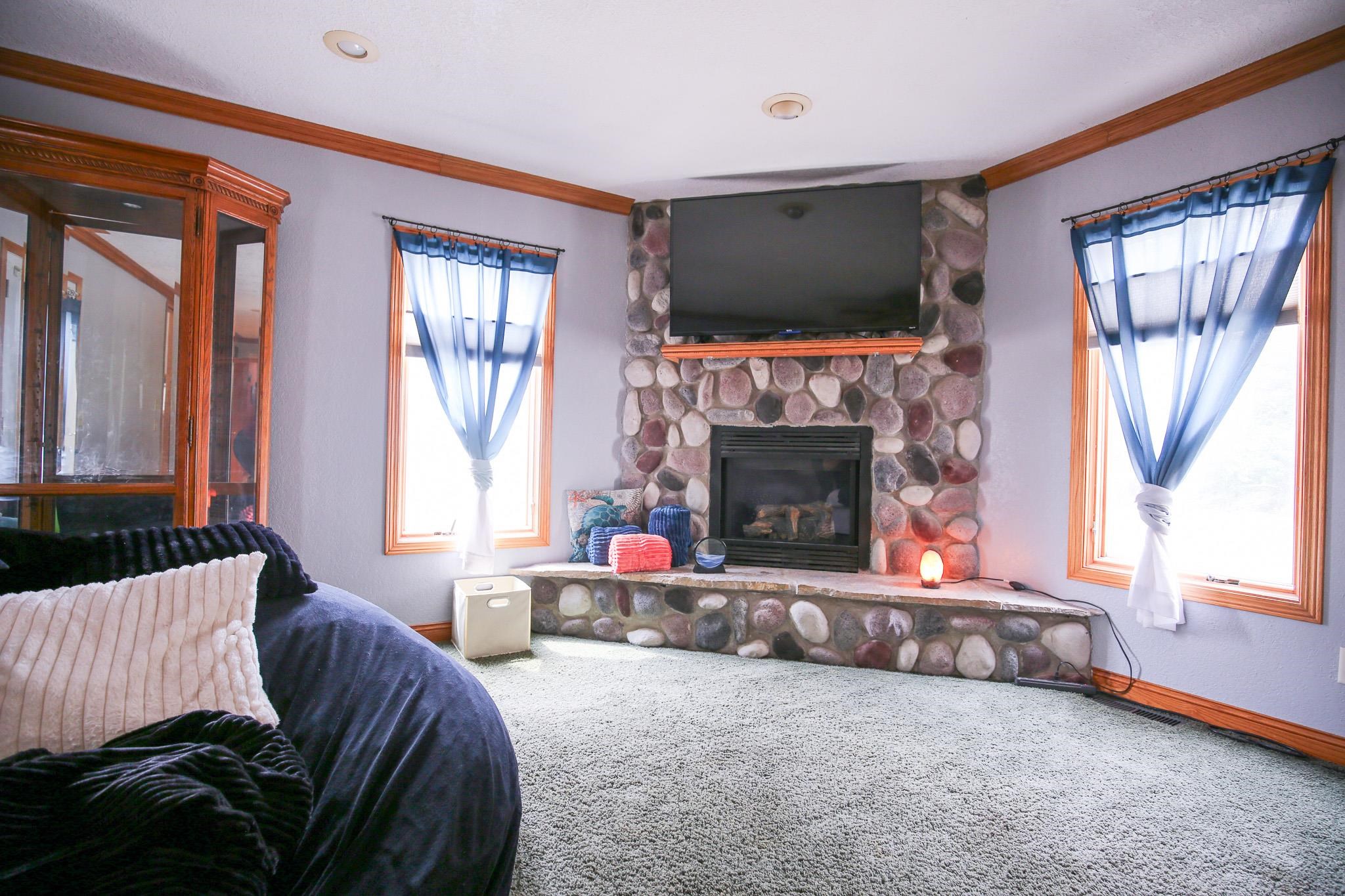 382 Keigwin Road Walnut, IL 61376 - Photo 36 of 68 a living room with furniture and a fireplace