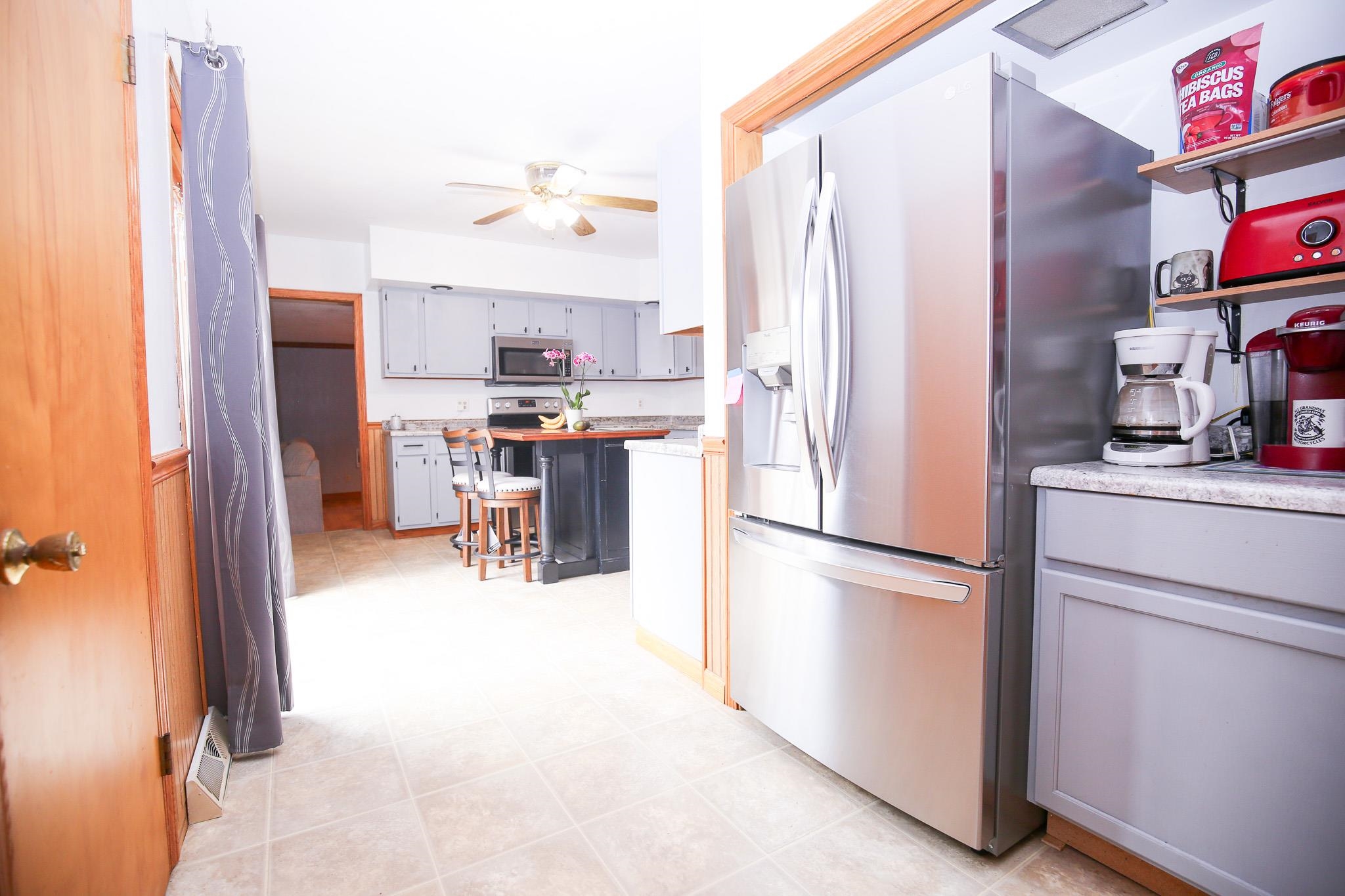 382 Keigwin Road Walnut, IL 61376 - Photo 42 of 68 a kitchen with stainless steel appliances granite countertop a refrigerator and a stove