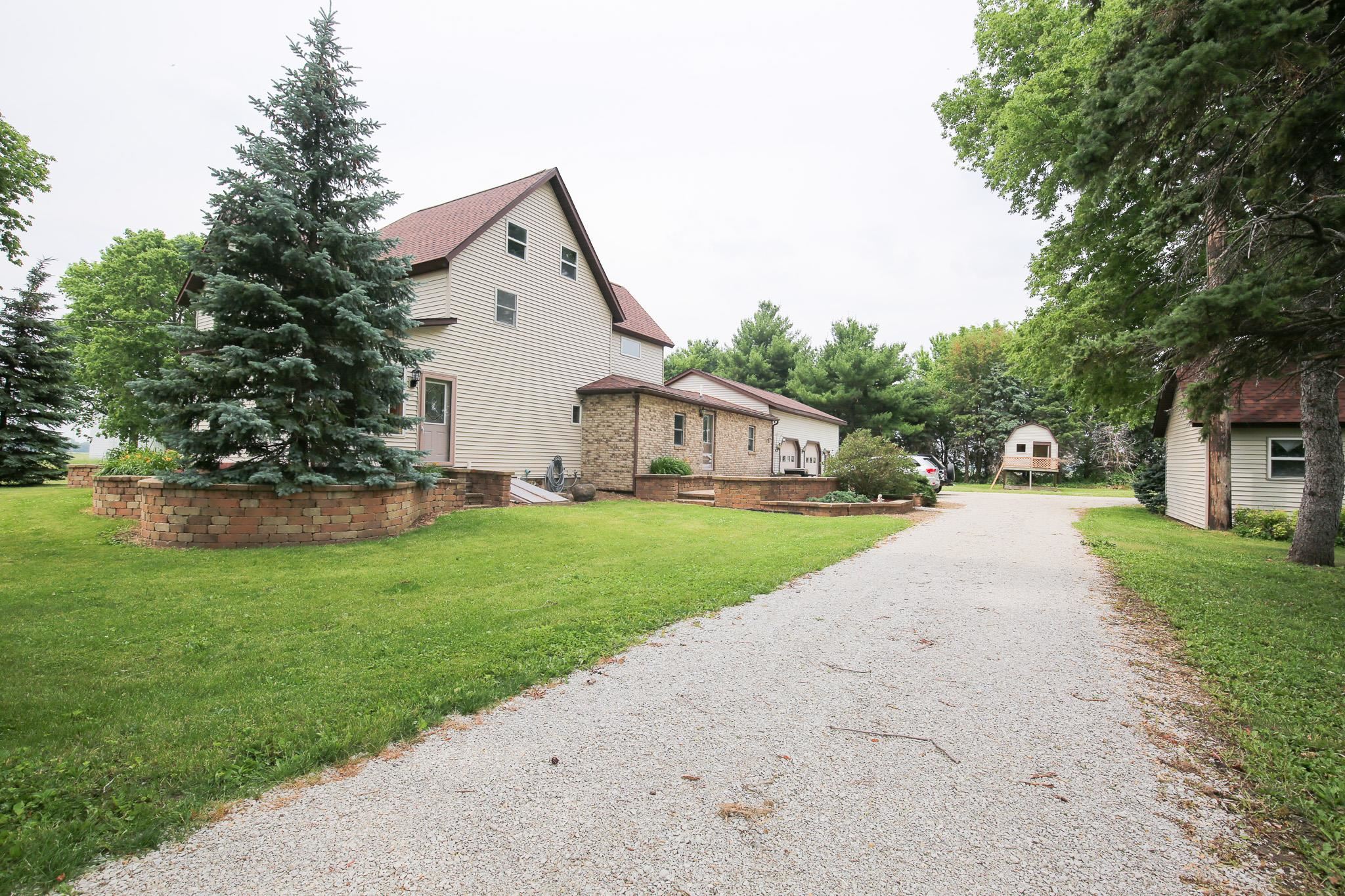 382 Keigwin Road Walnut, IL 61376 - Photo 57 of 68 a front view of a house with a yard and garage
