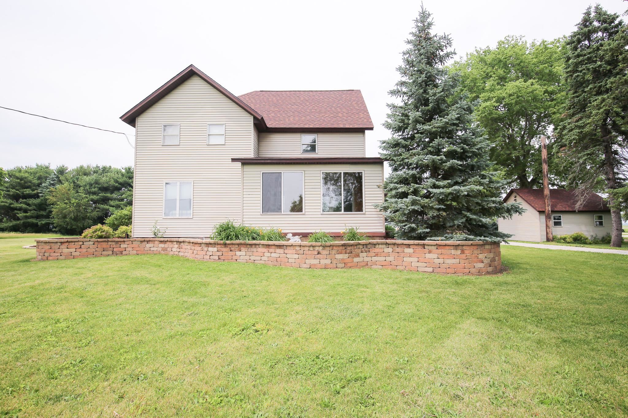 382 Keigwin Road Walnut, IL 61376 - Photo 59 of 68 a front view of a house with a yard and garage