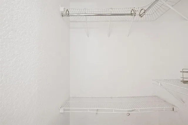 a bathroom with a shower and a bath tub