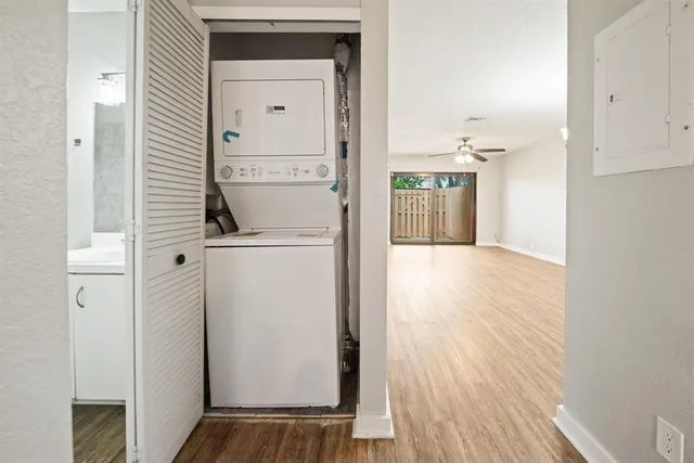 a view of a kitchen from a hallway