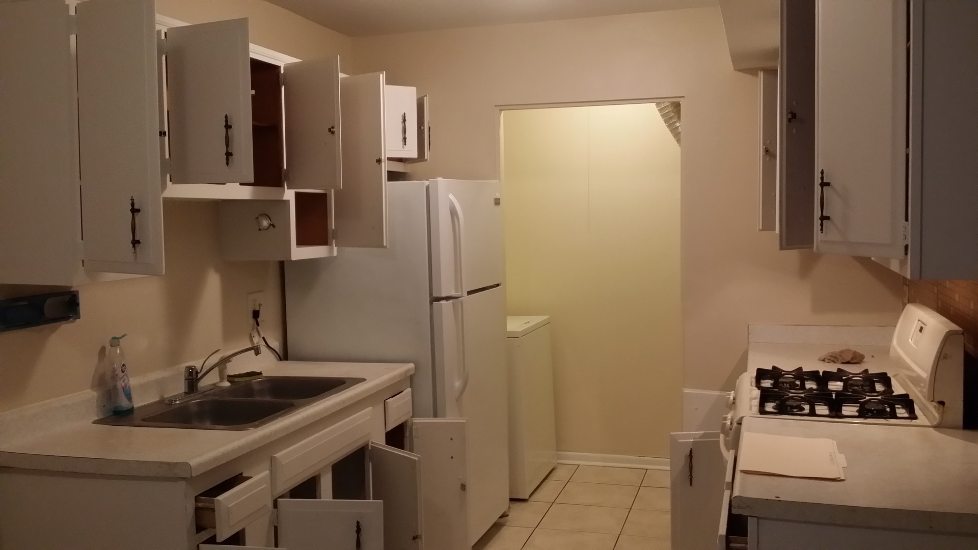 1854 Jamestown Circle Hoffman Estates, IL 60169 - Photo 3 of 10 a bathroom with a sink a refrigerator and a stove