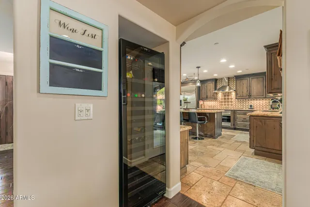 a living room with furniture pool table and flat screen tv