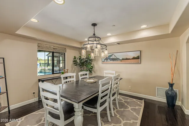 a living room with pool table and a flat screen tv