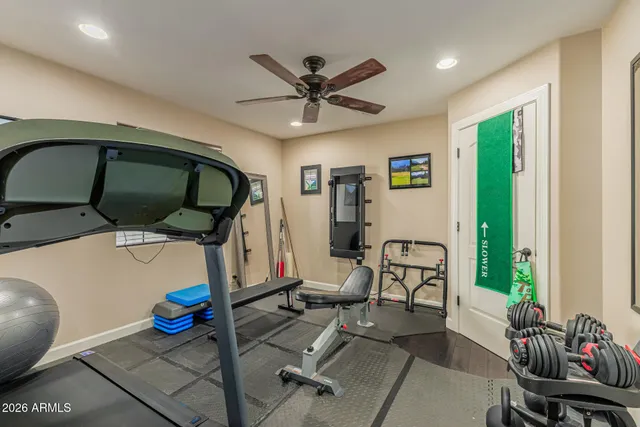 a living room with furniture ceiling fan and a window