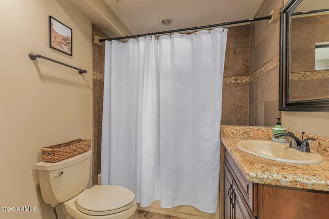 a utility room with sink dryer and washer