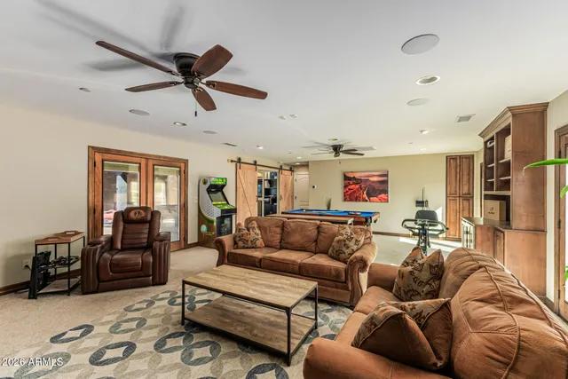 a bedroom with a bed and a couch