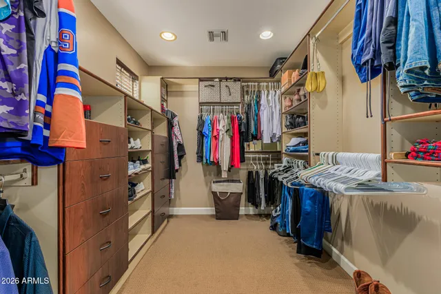 a living room with furniture and a flat screen tv with wooden floor