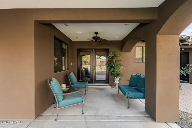 a bedroom with a bed and a ceiling fan