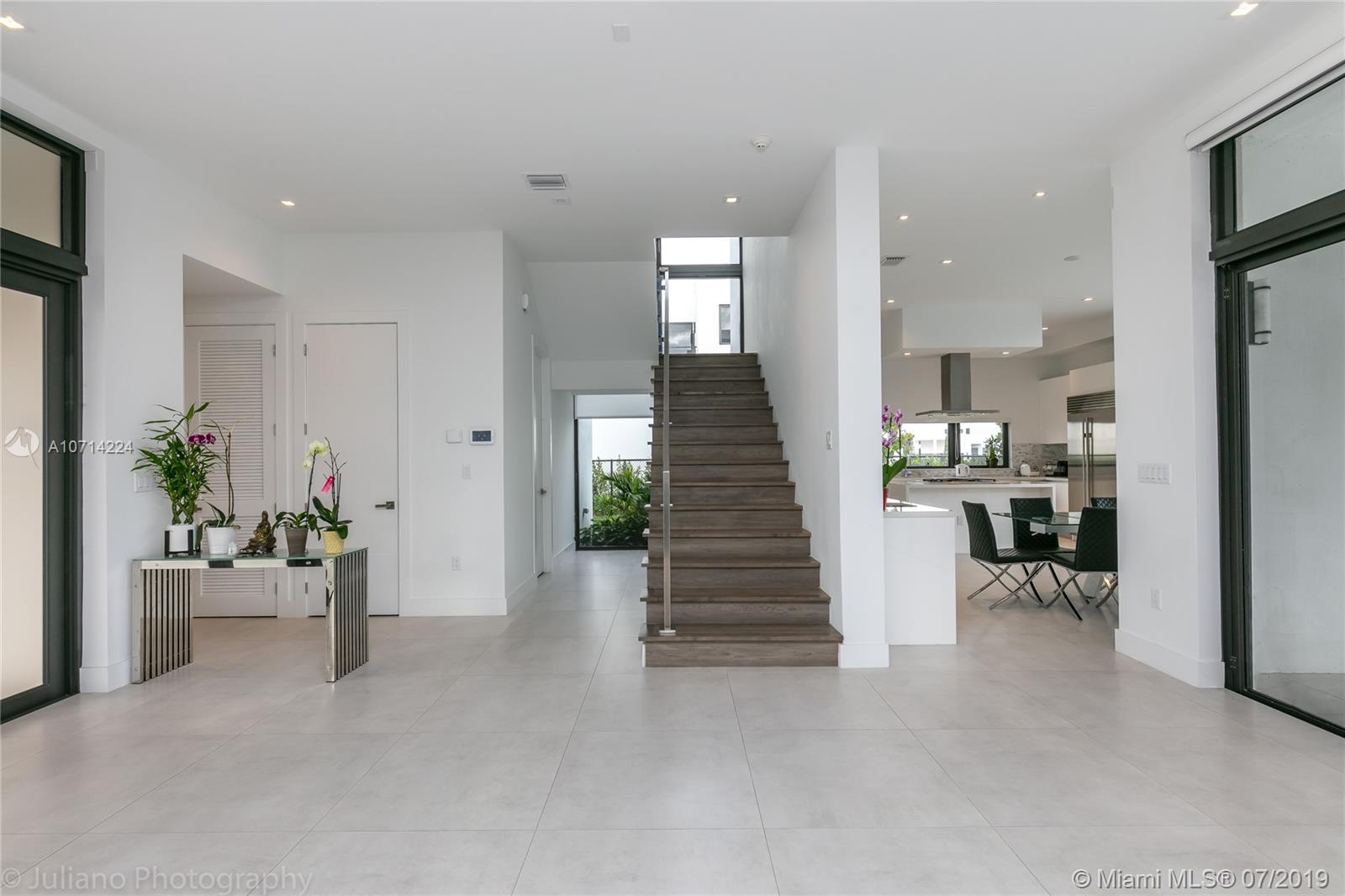 16630 Sunset Way Weston, FL 33326 - Photo 11 of 17 a view of a hallway with seating area