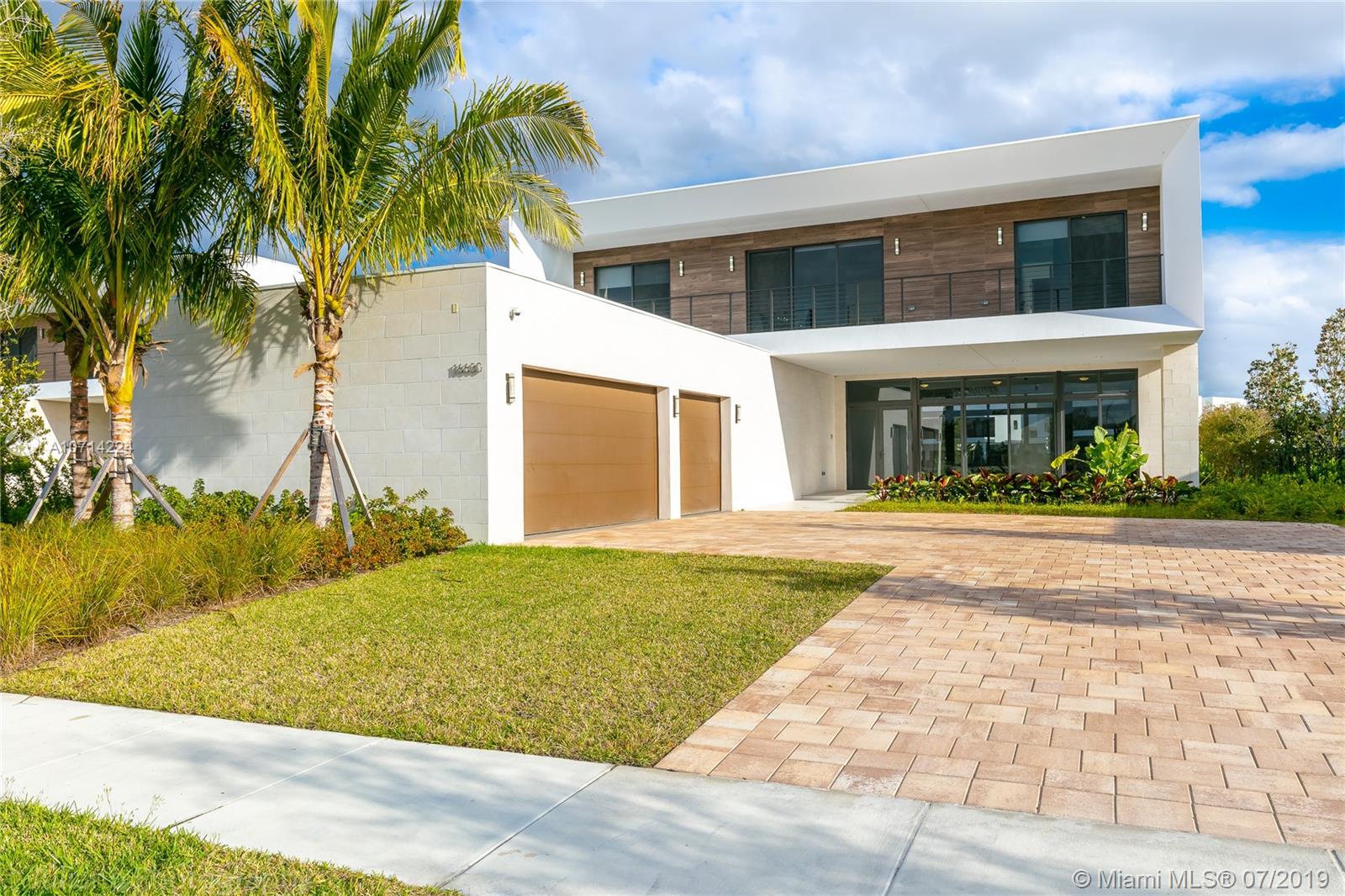 16630 Sunset Way Weston, FL 33326 - Photo 2 of 17 a view of house with yard and palm trees