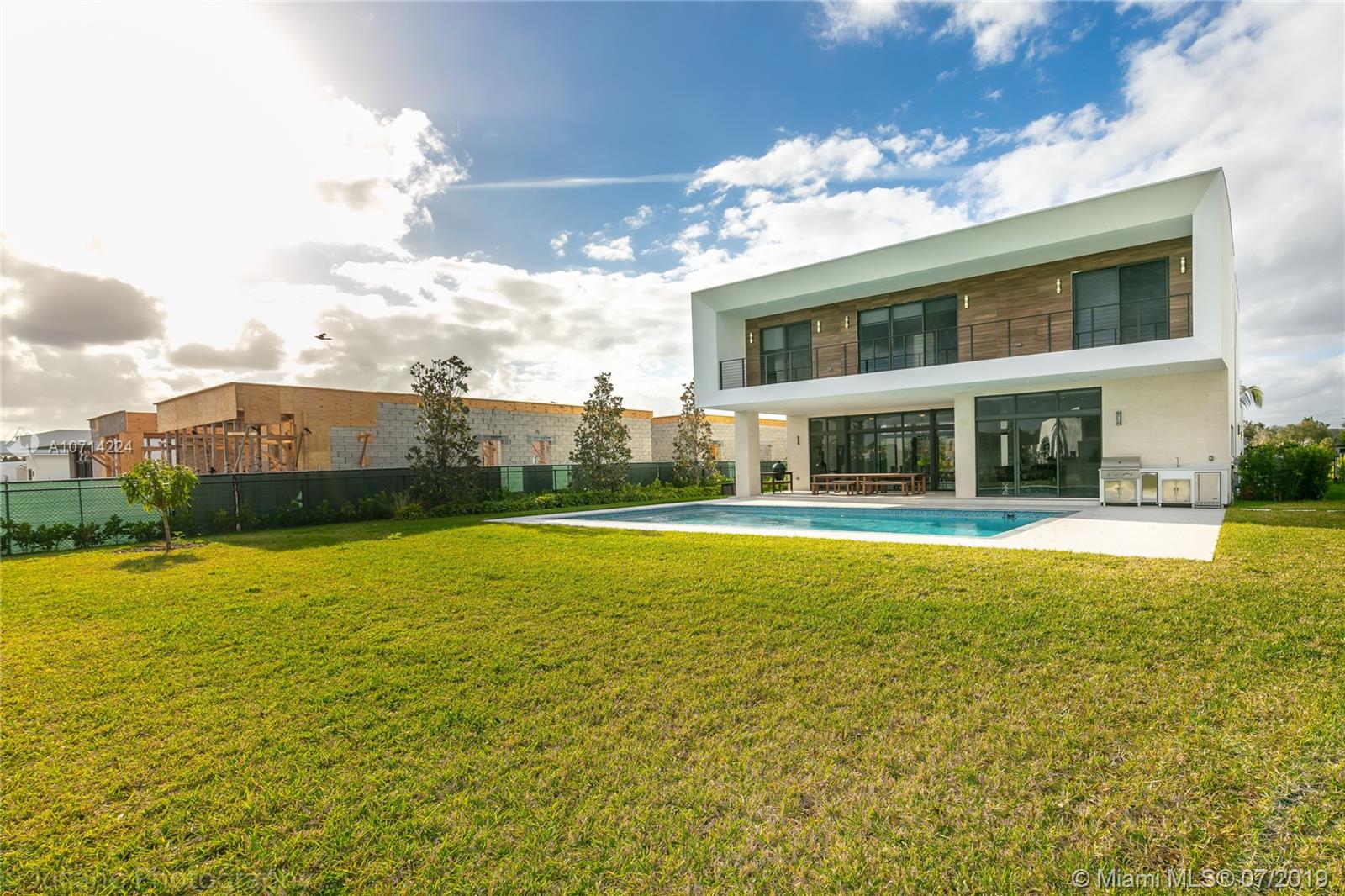16630 Sunset Way Weston, FL 33326 - Photo 4 of 17 a view of a house with a swimming pool