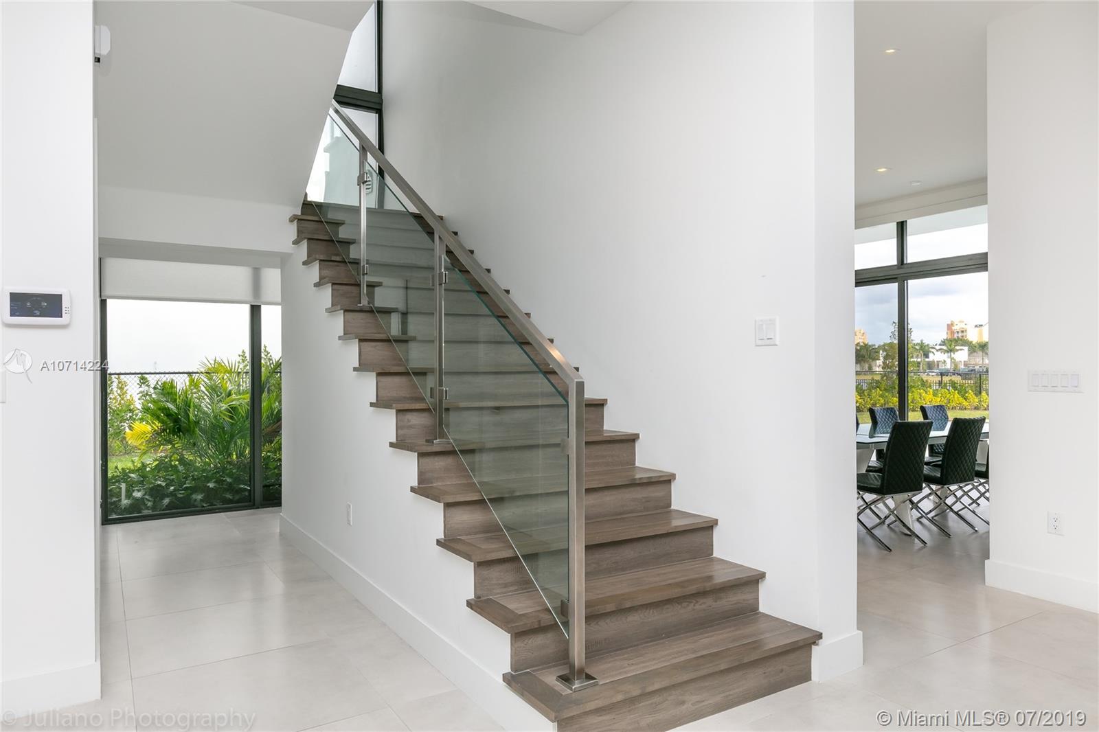 16630 Sunset Way Weston, FL 33326 - Photo 9 of 17 a view of entryway and hall with wooden floor