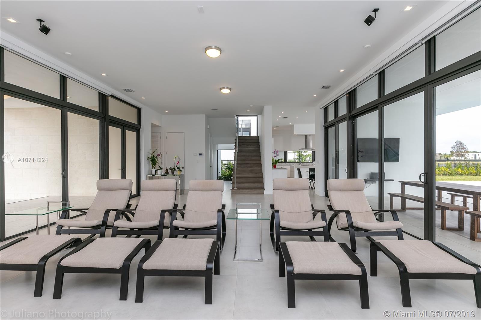 16630 Sunset Way Weston, FL 33326 - Photo 10 of 17 a dining room with furniture and large windows