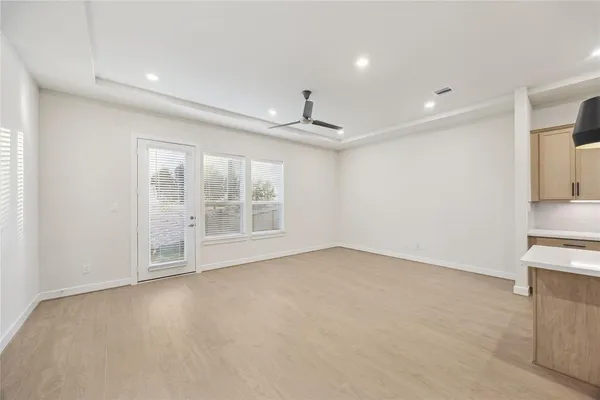 a view of an empty room with a window