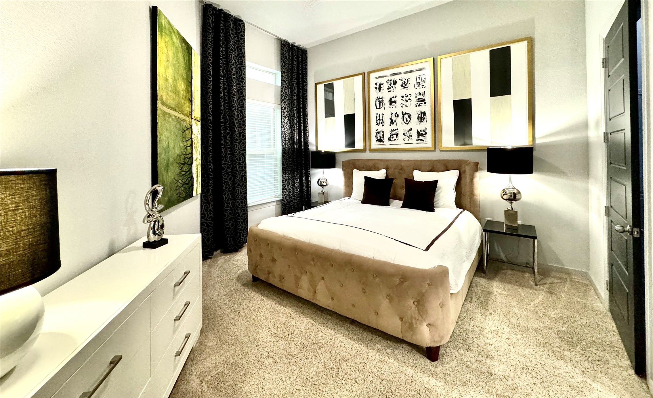 2525 McCue Road, Unit 249 Houston, TX 77056 - Photo 10 of 13 a spacious bedroom with a large bed and a large window