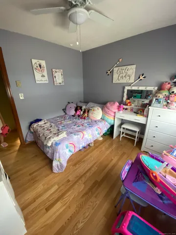 a bathroom with a sink toilet mirror and shower