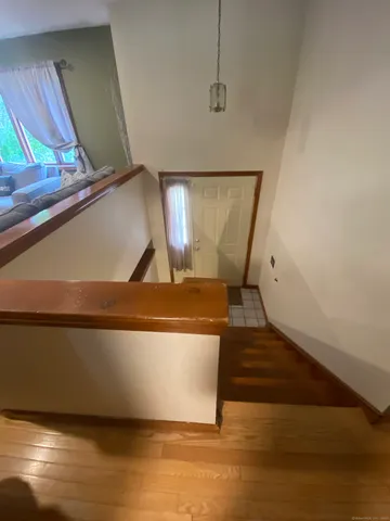 a kitchen with stainless steel appliances kitchen island granite countertop a sink dishwasher stove and oven with cabinets