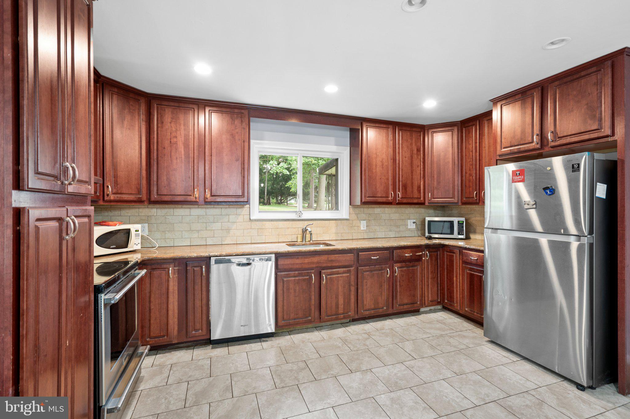 609 Foster Road Cheltenham, PA 19012 - Photo 7 of 44 Warm wood tones in a modern kitchen.