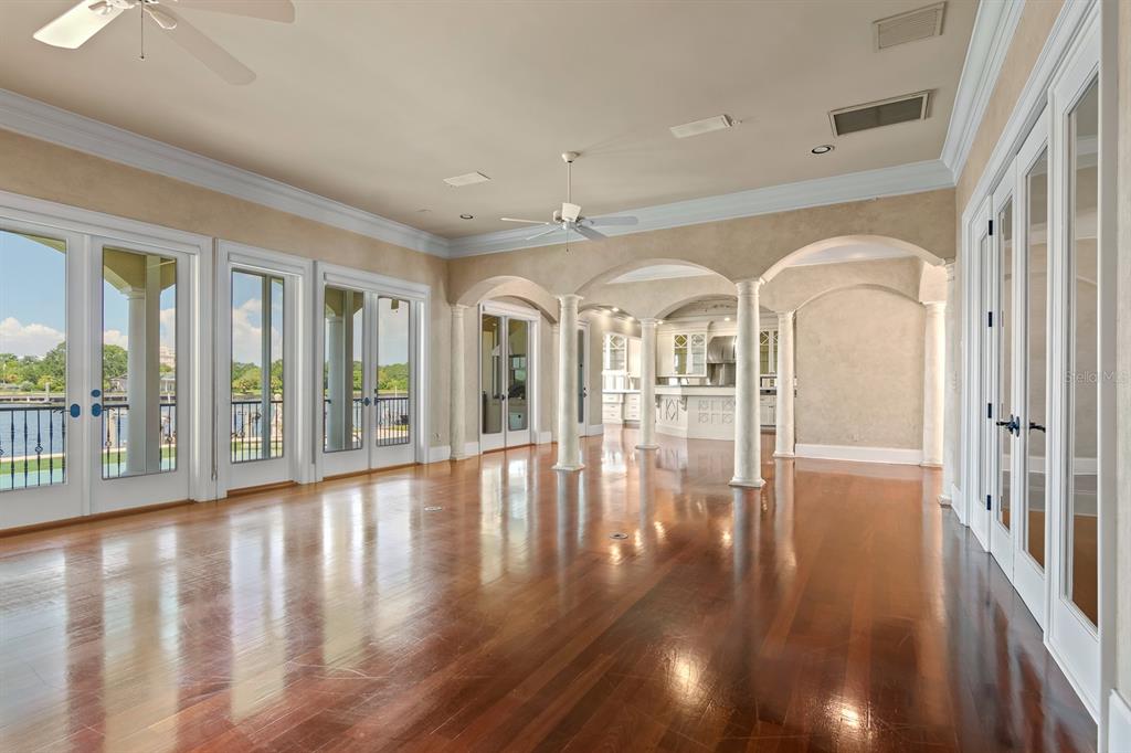 1029 Royal Pass Road Tampa, FL 33602 - Photo 16 of 68 a view of empty room with wooden floor and floor to ceiling window