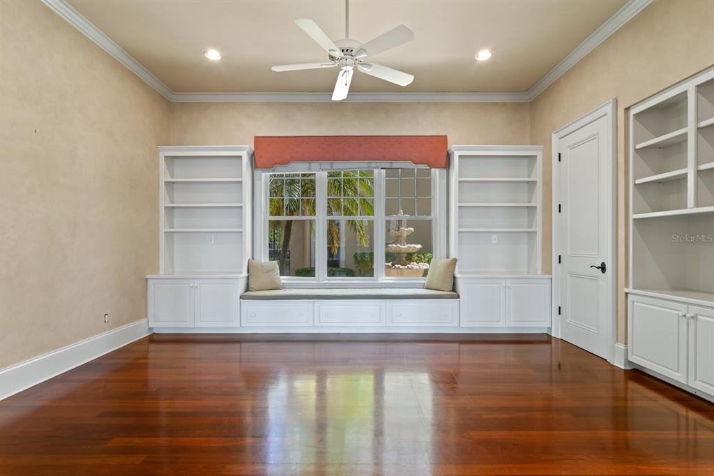 1029 Royal Pass Road Tampa, FL 33602 - Photo 19 of 68 an empty room with wooden floor and windows