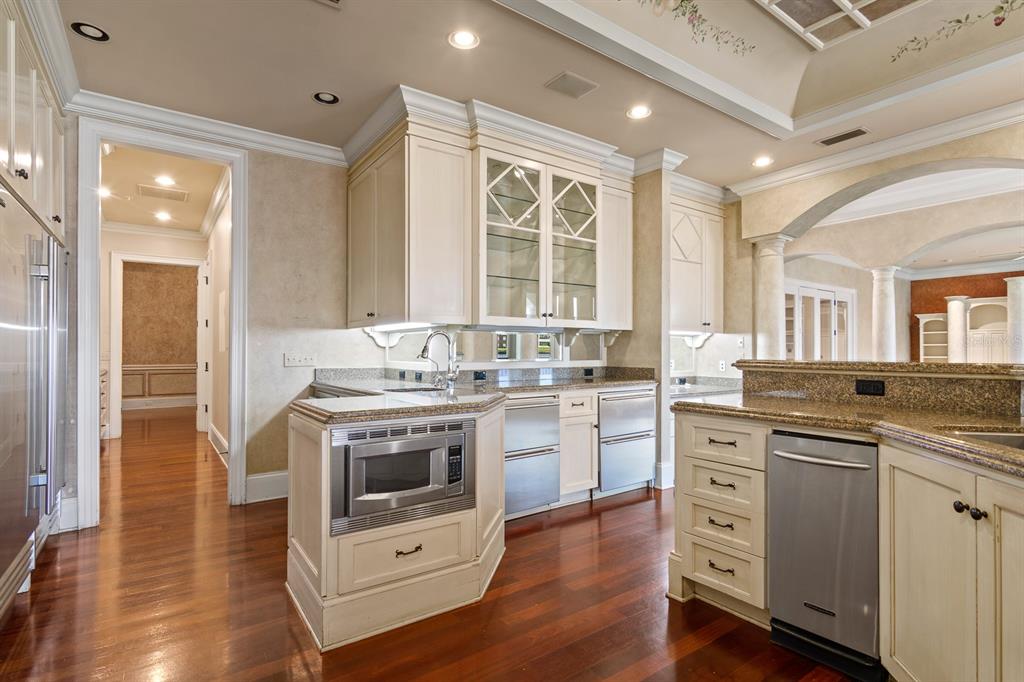 1029 Royal Pass Road Tampa, FL 33602 - Photo 22 of 68 a kitchen with a stove a sink and a refrigerator