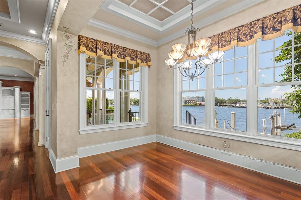 1029 Royal Pass Road Tampa, FL 33602 - Photo 25 of 68 a view of a living room with a large window and chandelier