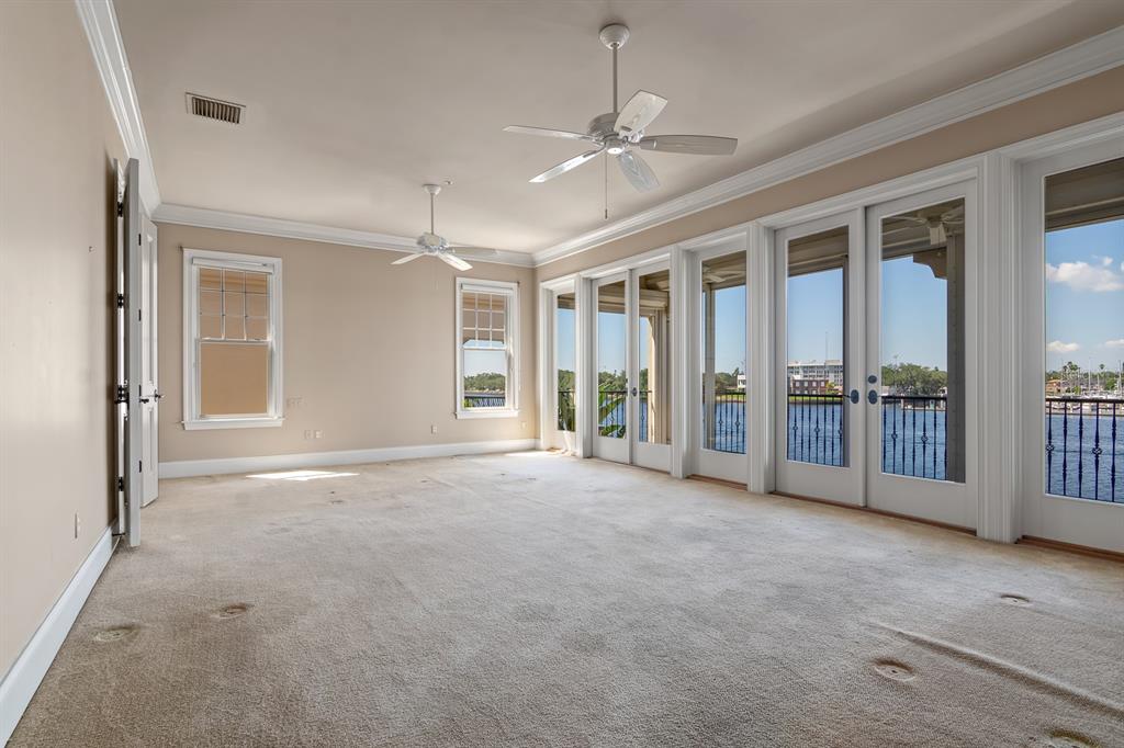 1029 Royal Pass Road Tampa, FL 33602 - Photo 31 of 68 a view of an empty room with glass door and balcony