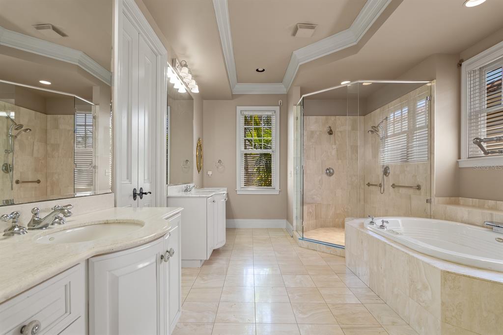1029 Royal Pass Road Tampa, FL 33602 - Photo 35 of 68 a spacious bathroom with a bathtub shower sink and mirror