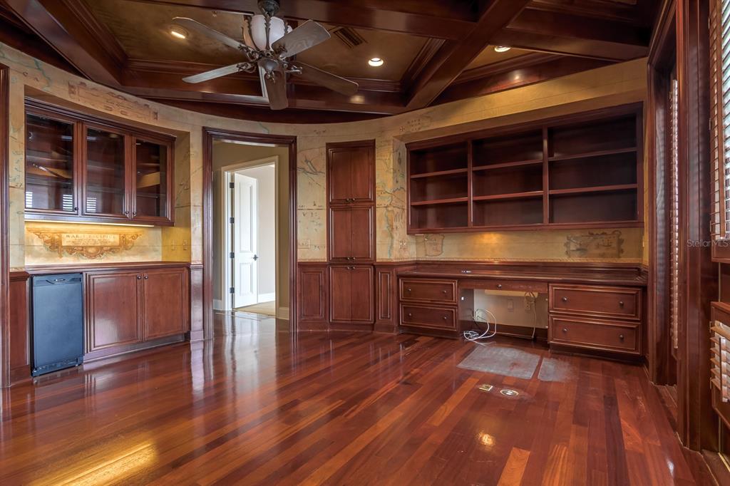 1029 Royal Pass Road Tampa, FL 33602 - Photo 39 of 68 a room with wooden floor and furniture