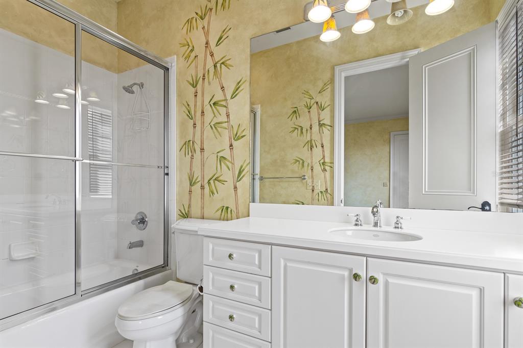 1029 Royal Pass Road Tampa, FL 33602 - Photo 45 of 68 a bathroom with a sink a toilet and shower