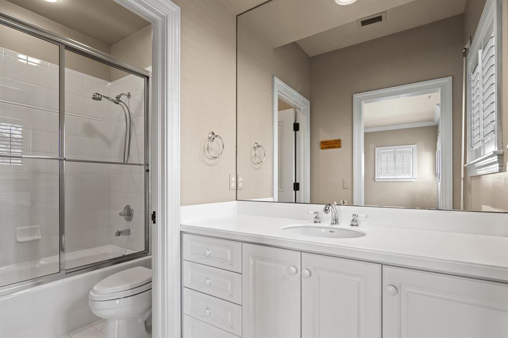 1029 Royal Pass Road Tampa, FL 33602 - Photo 48 of 68 a bathroom with a granite countertop sink a toilet and shower