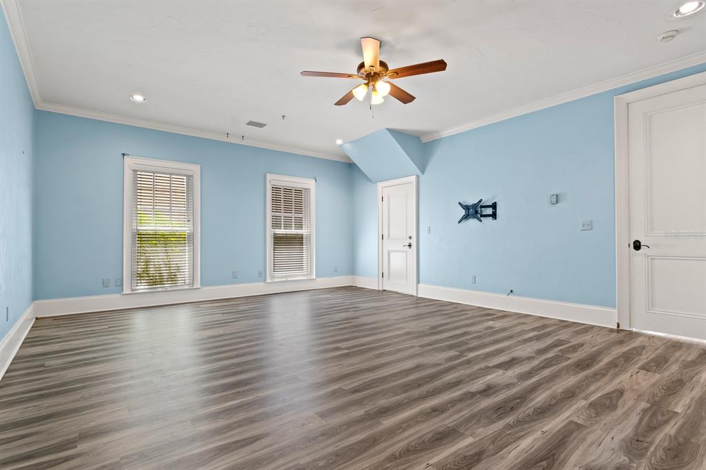 1029 Royal Pass Road Tampa, FL 33602 - Photo 49 of 68 a view of an empty room with wooden floor and a window