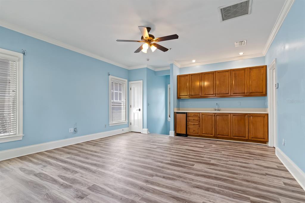 1029 Royal Pass Road Tampa, FL 33602 - Photo 51 of 68 a view of empty room with wooden floor and fan